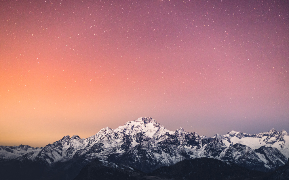 Starry Sky Under Snow Covered Mountains